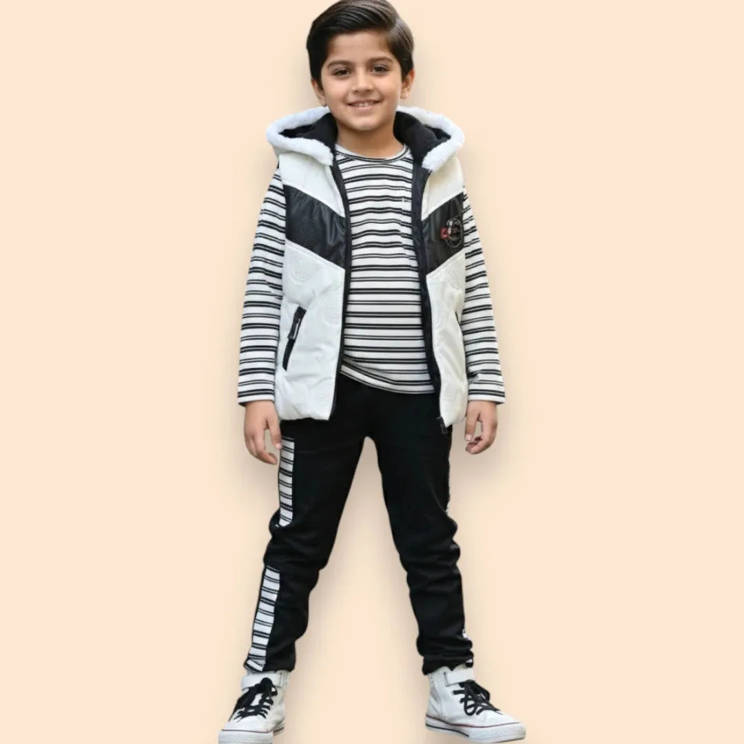 Boy wearing black and white hooded winter jacket, striped shirt, and matching jogger pants.