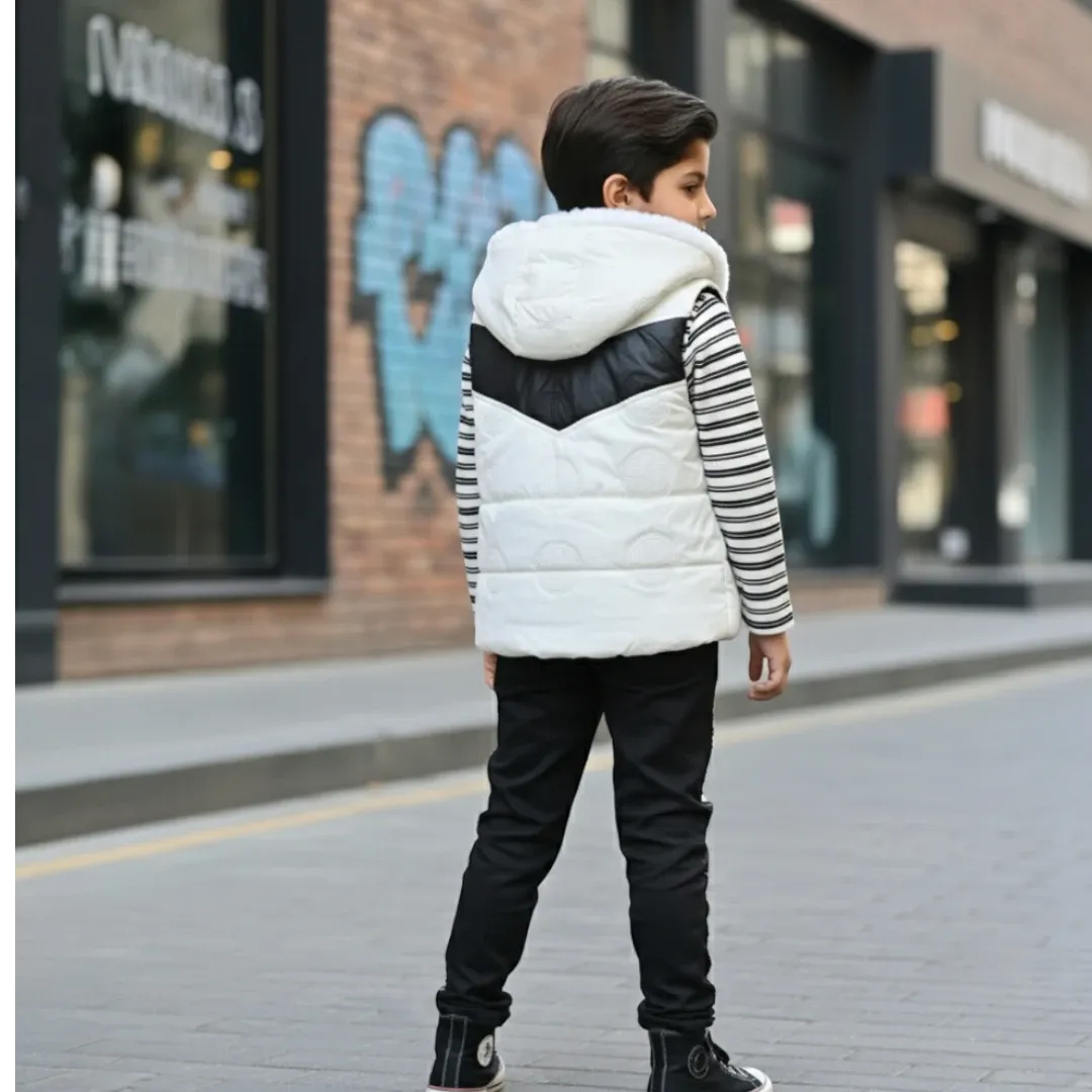 Boy wearing black and white hooded winter jacket, striped shirt, and matching jogger pants.